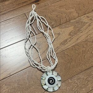 Elegant White Beaded Necklace with Spiral Pendant